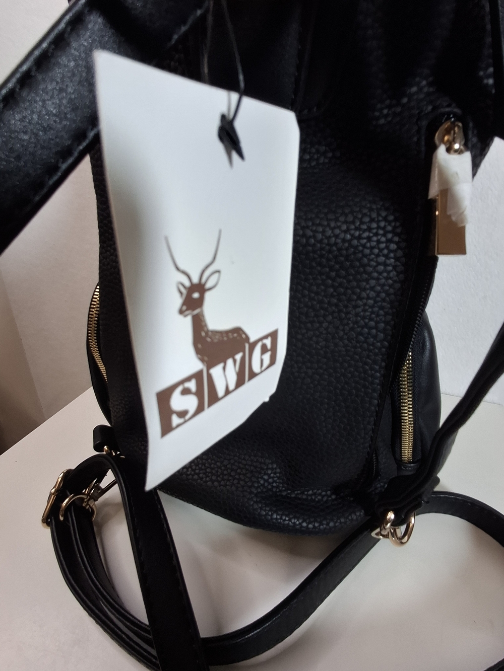 SWG Black Pebbled Sling Barrel Backpack with Gold Accents - Picture 5 of 11